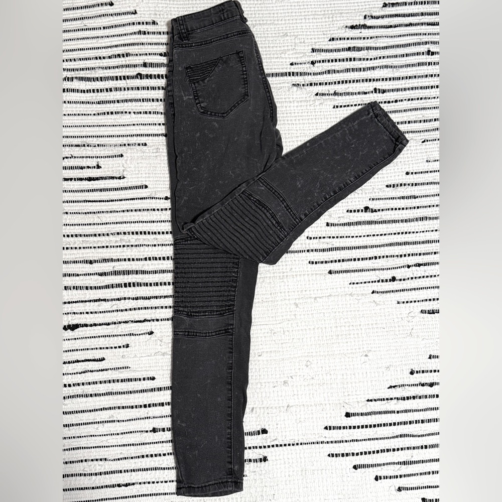 Women’s low rise moto jeans in distressed black wash